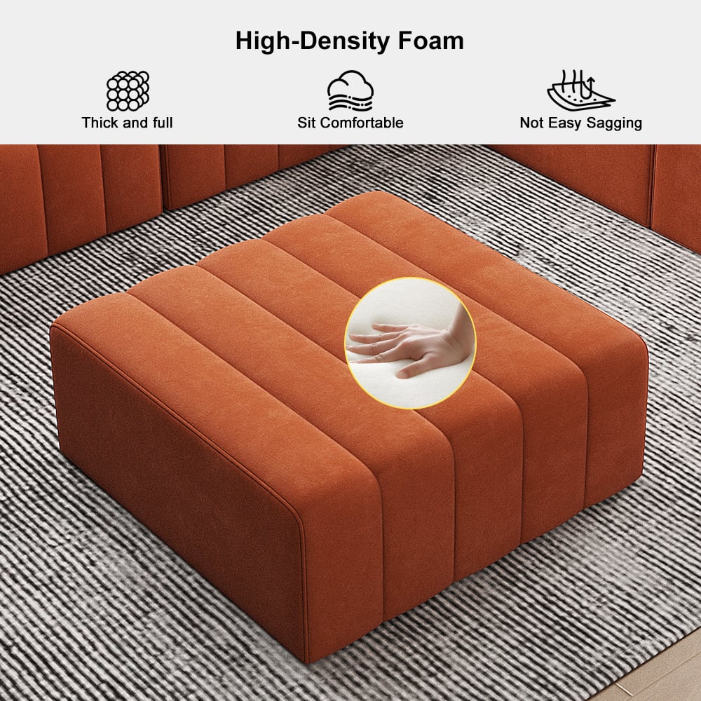 Orange ottoman with high-density foam features on a striped rug