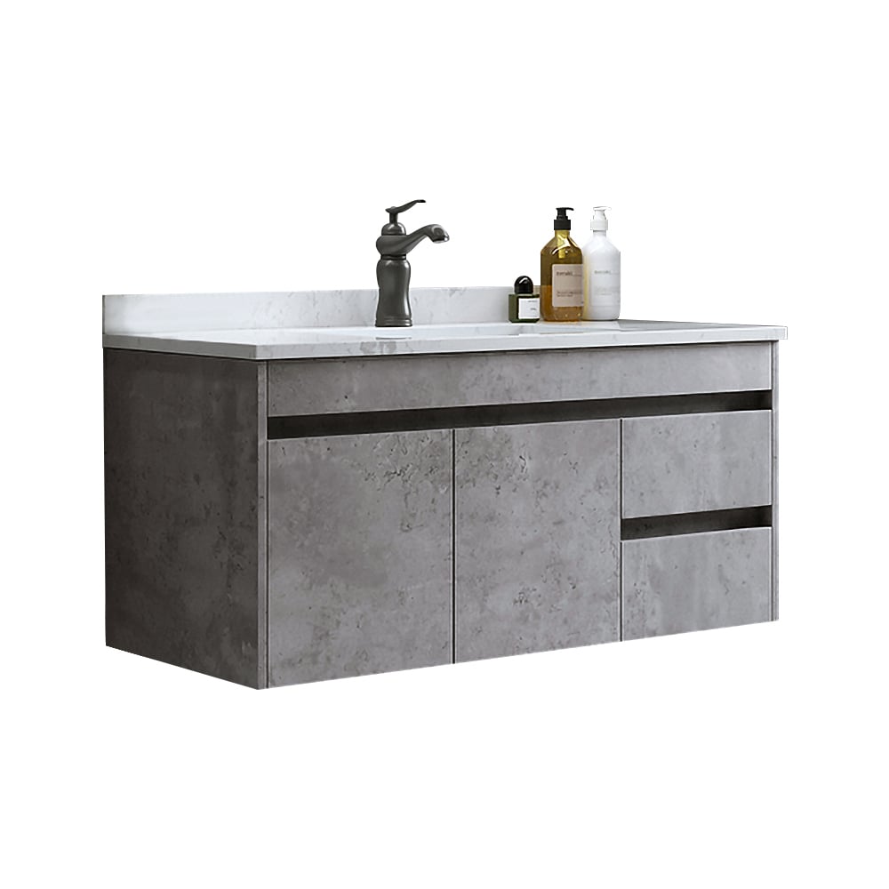 Bathroom vanity with concrete finish, white countertop, and sink.