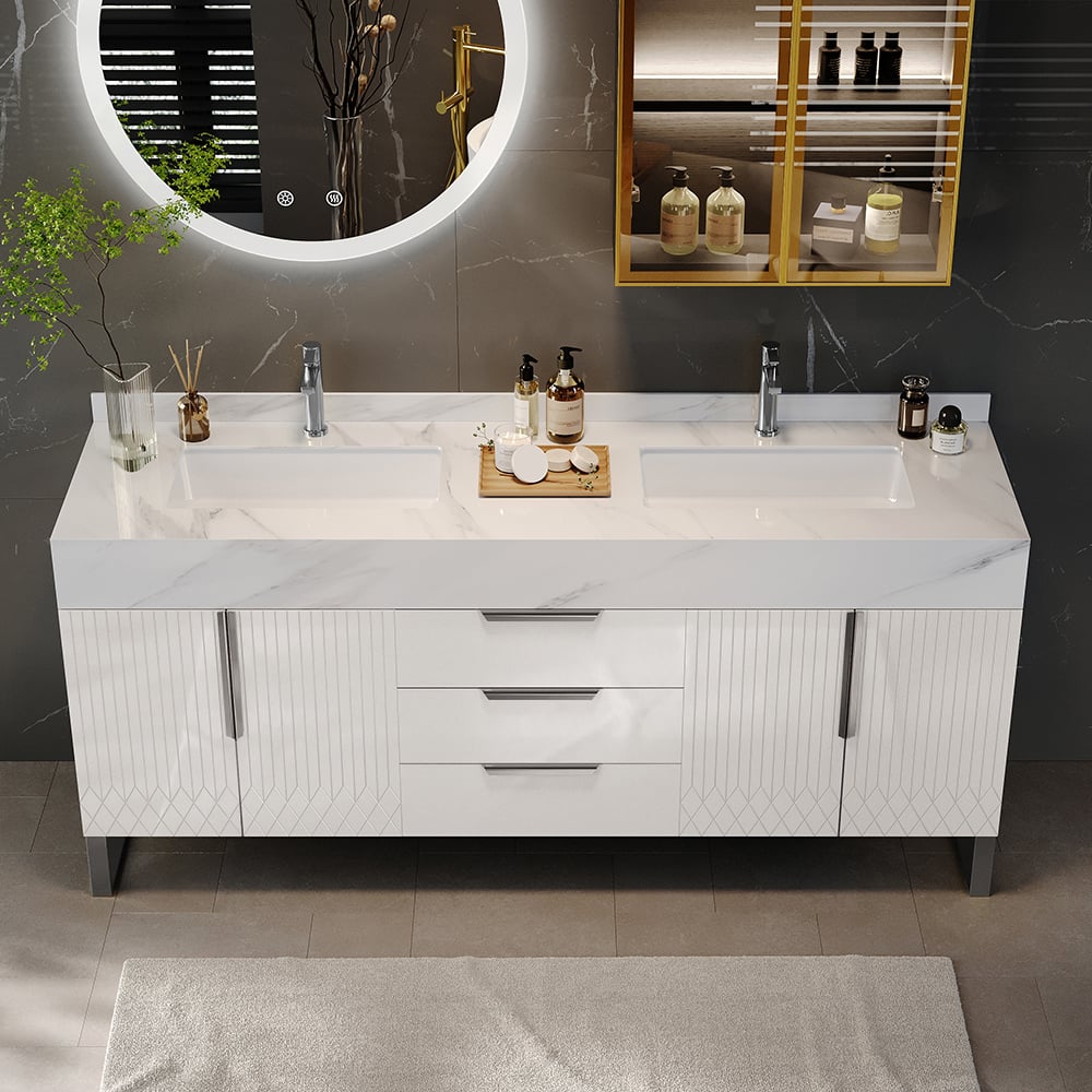 Bathroom vanity with two sinks, mirror, and decorative items.