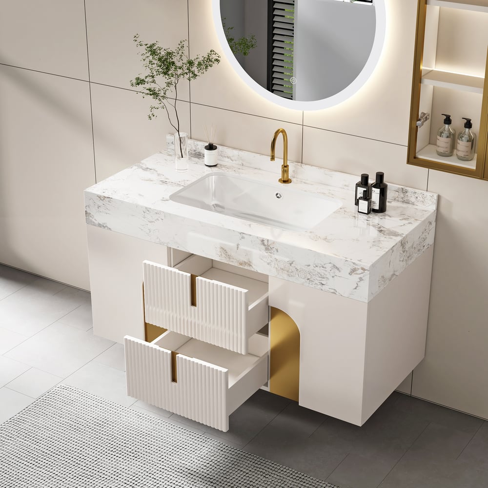Modern bathroom vanity with marble countertop, sink, and gold fixtures.