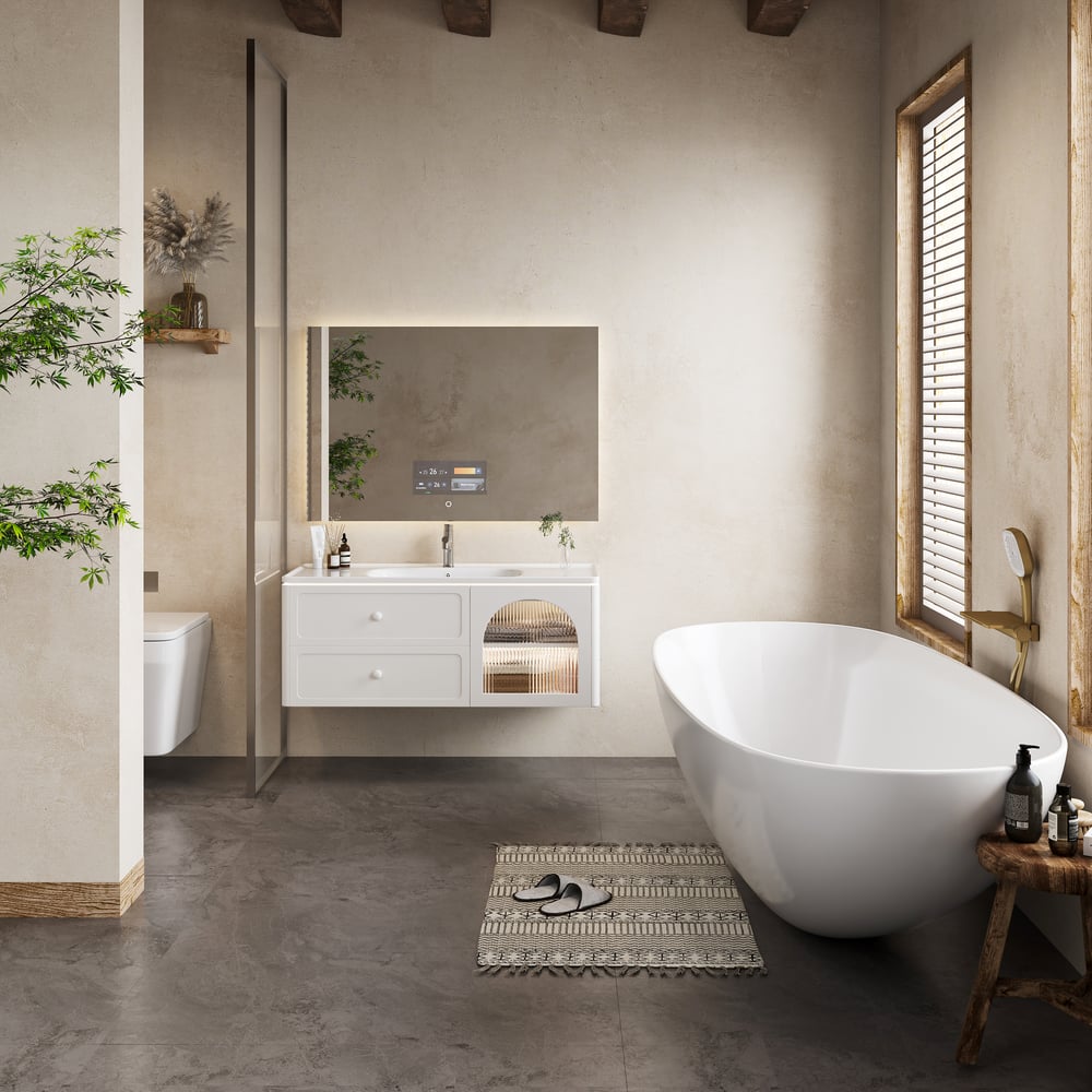 Modern bathroom with freestanding bathtub, sink, and mirror.