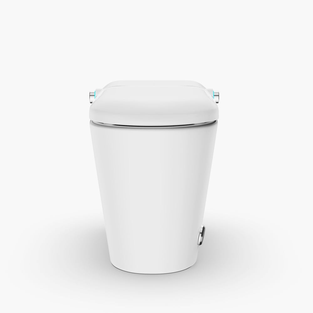 White toilet bowl with cover on a white background