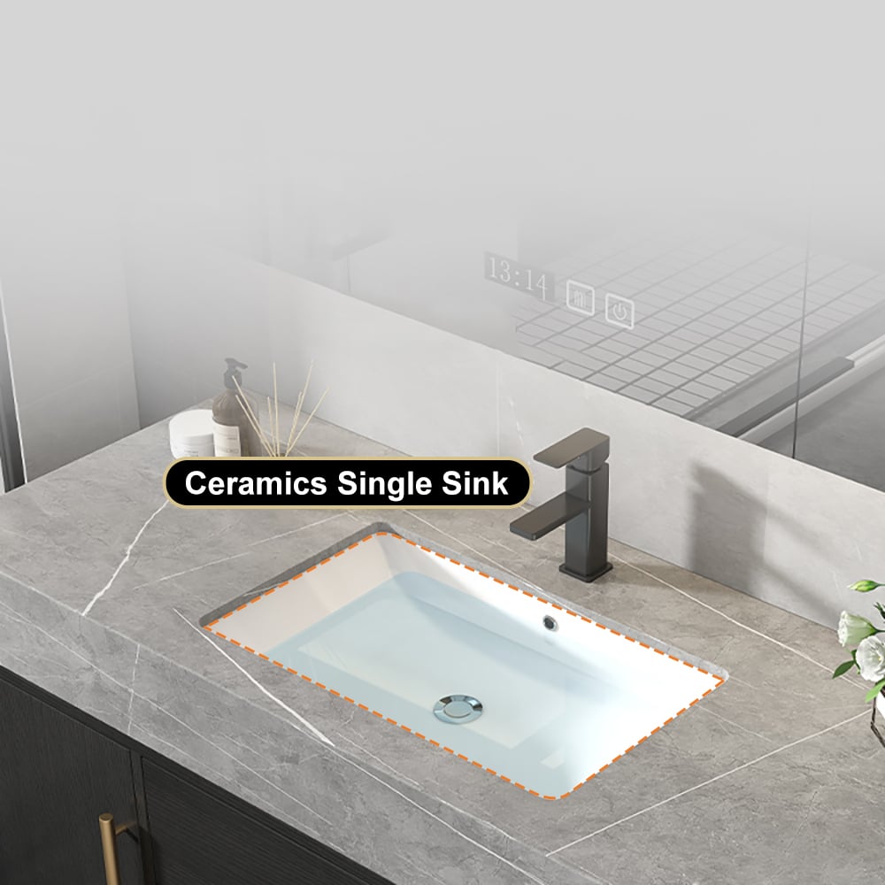 Ceramic single sink with black faucet on a gray countertop in a bathroom setting.