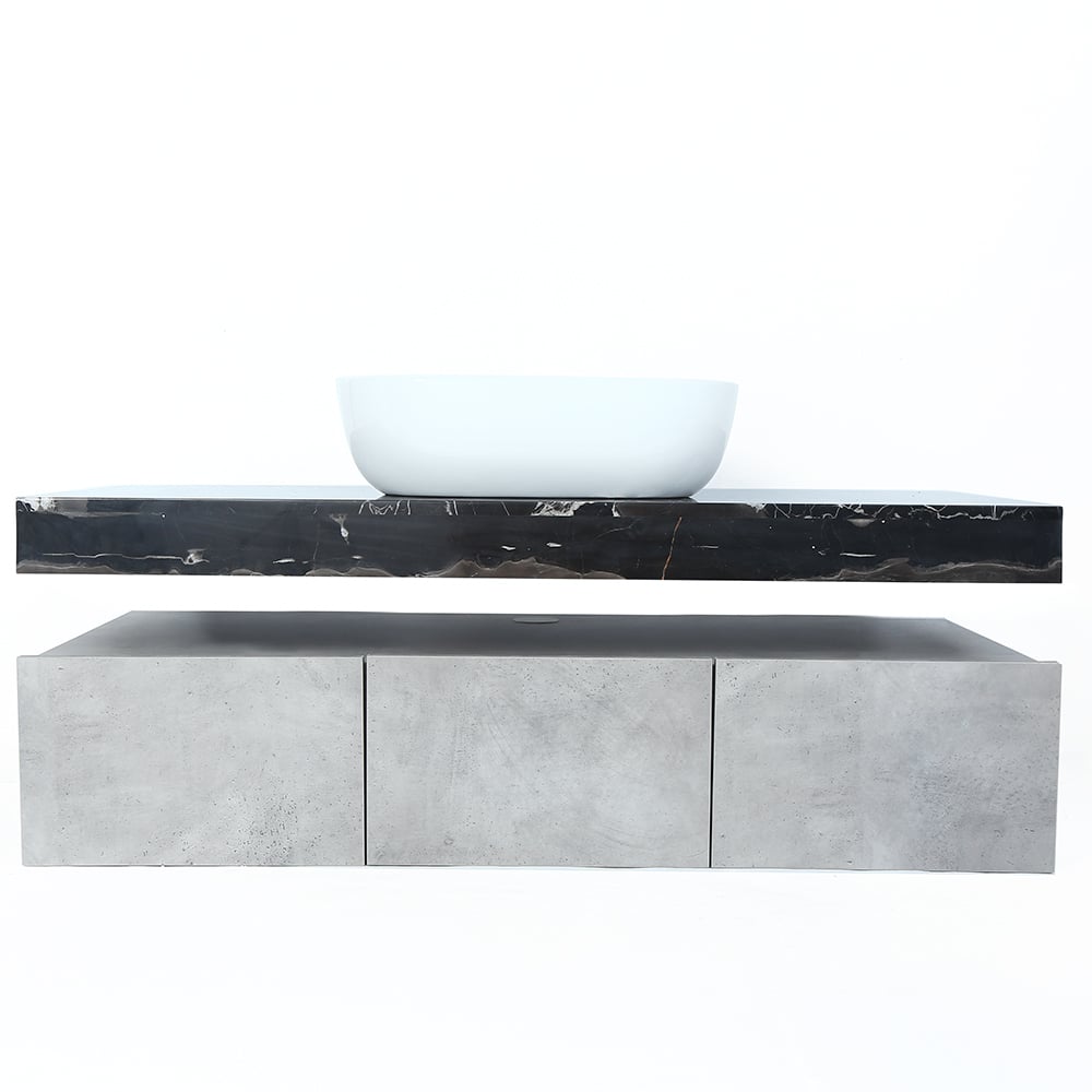 Bathroom vanity with black marble countertop and white basin on a white background