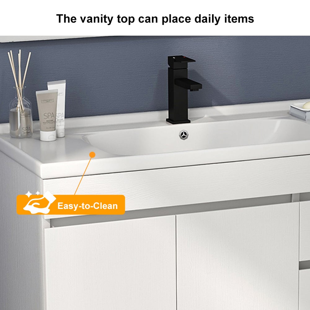 Bathroom vanity with white countertop, black faucet, and toiletries.