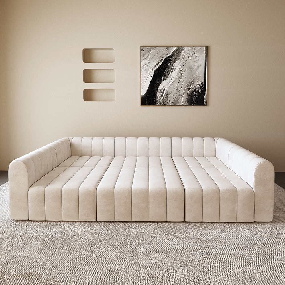 Off white sofa in a room with abstract art on the wall