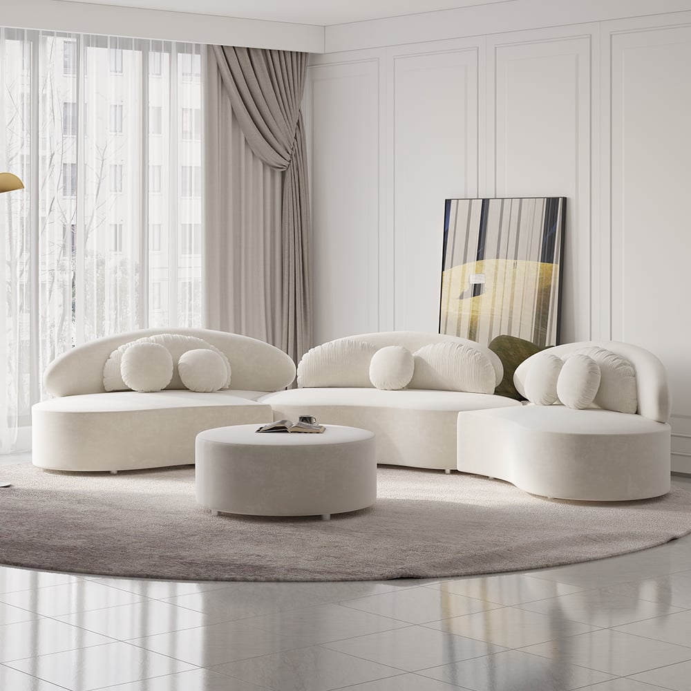 Modern white sectional sofa in a stylish living room with a mirror and curtains.