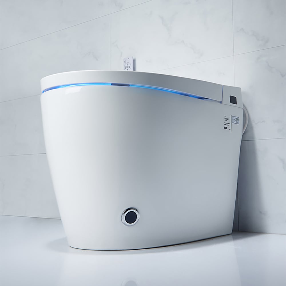 Modern toilet with a white seat against a tiled wall
