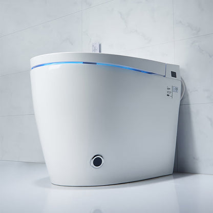 Modern toilet with a white seat against a tiled wall