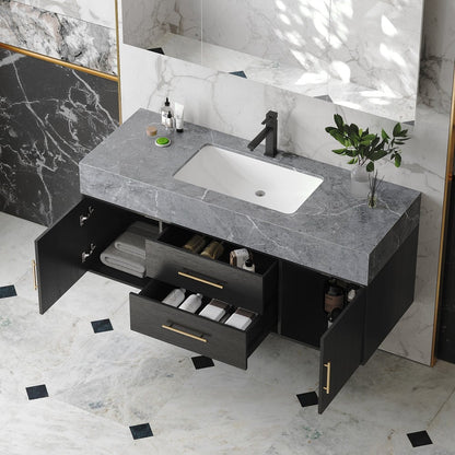 Bathroom vanity with open drawers, sink, and decorative elements on a marble floor.