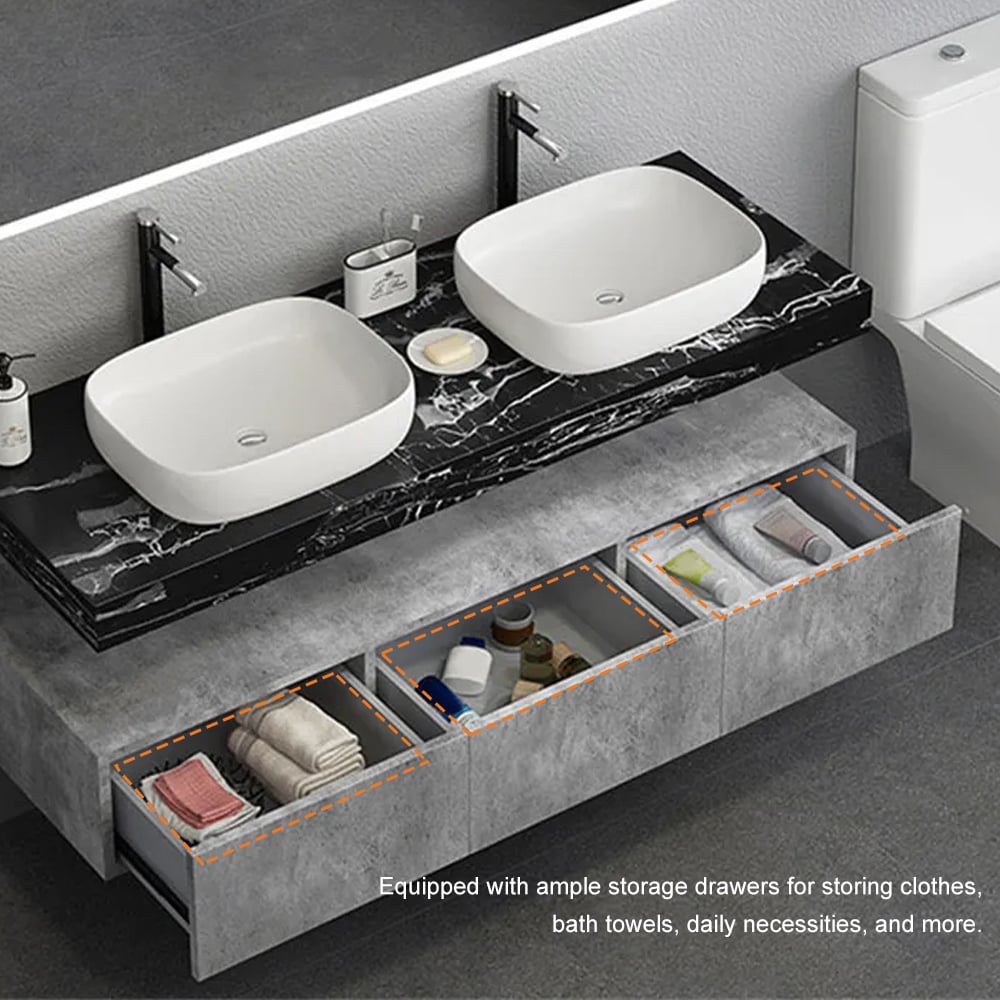 Bathroom vanity with two white sinks and open drawers containing towels and toiletries.