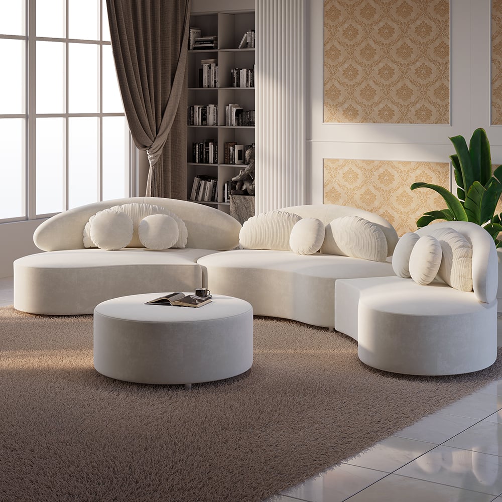 Modern living room with a white sectional sofa and round ottoman.