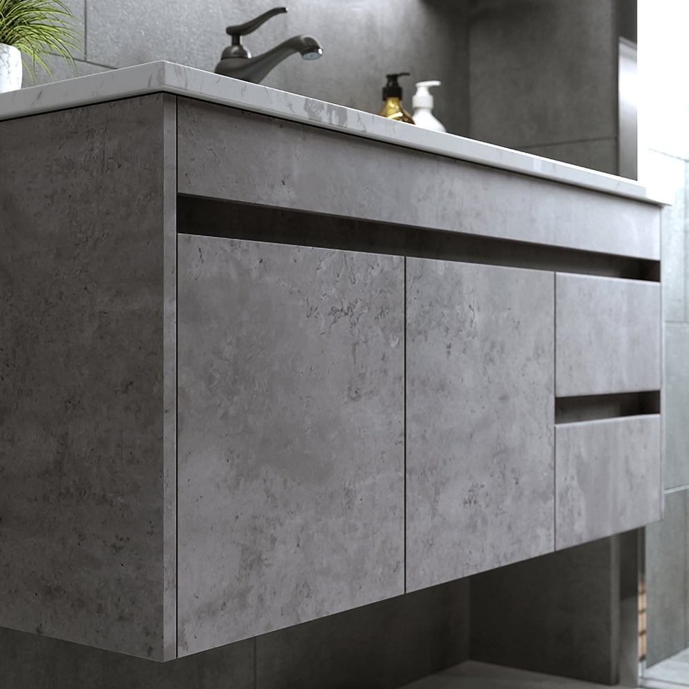 Bathroom vanity with concrete-like finish and faucet in a modern bathroom setting.