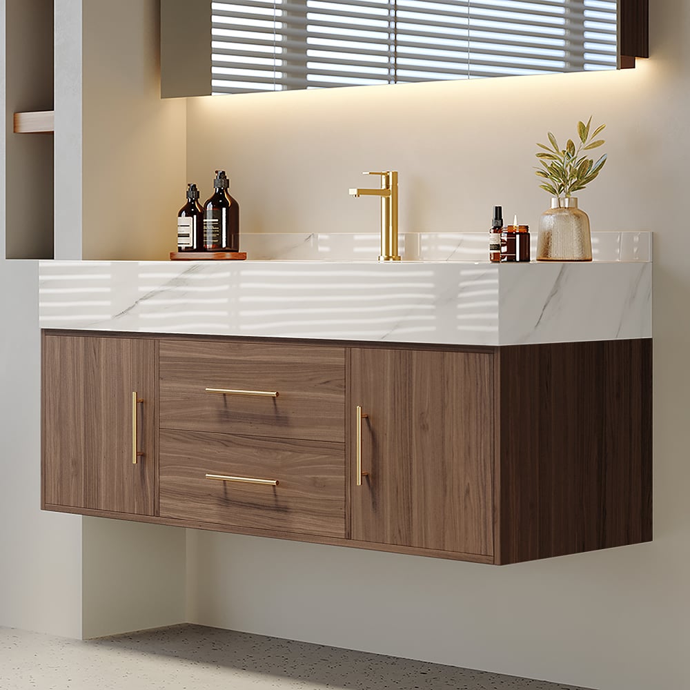 Bathroom vanity with wooden cabinets, white countertop, and gold fixtures.