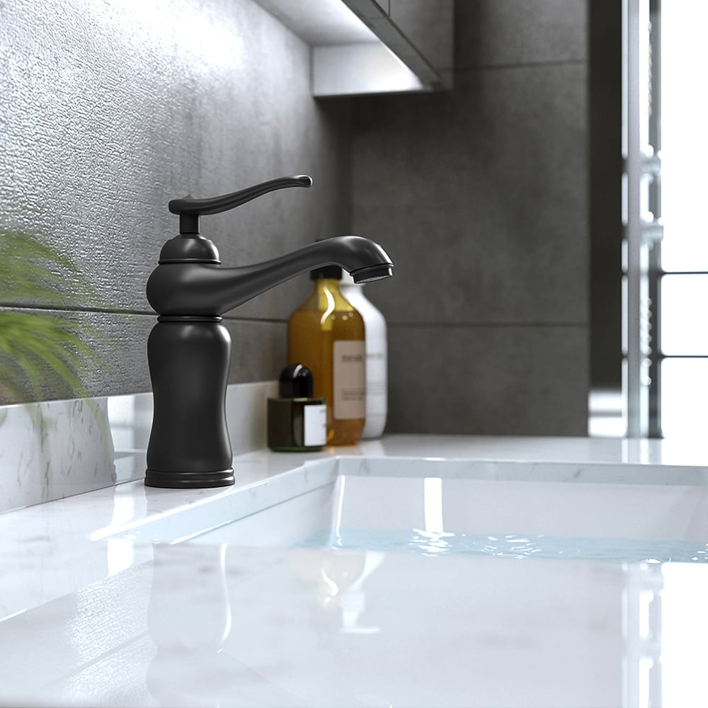 Black faucet on a white countertop with a modern kitchen background