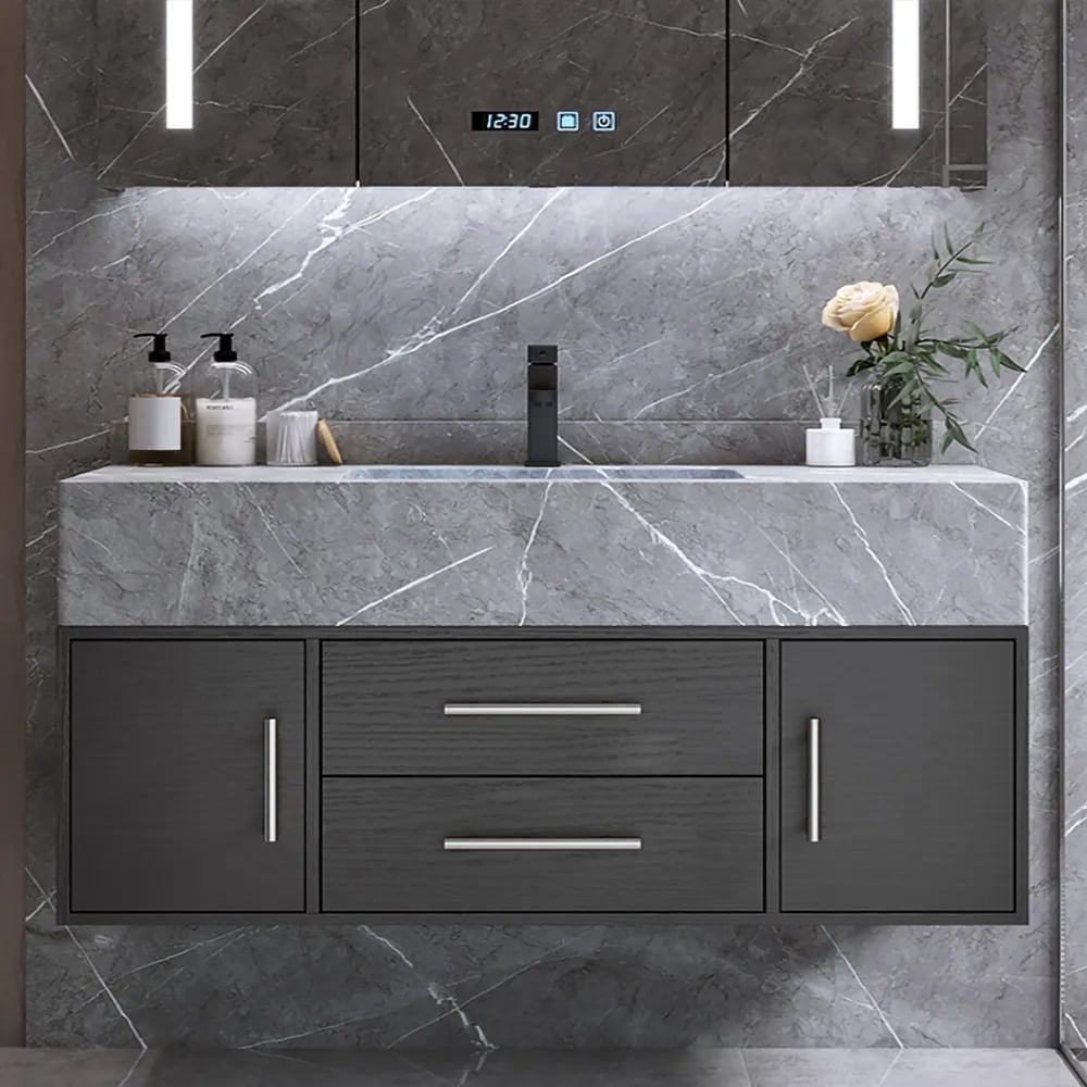 Bathroom vanity with gray marble countertop and dark cabinets.