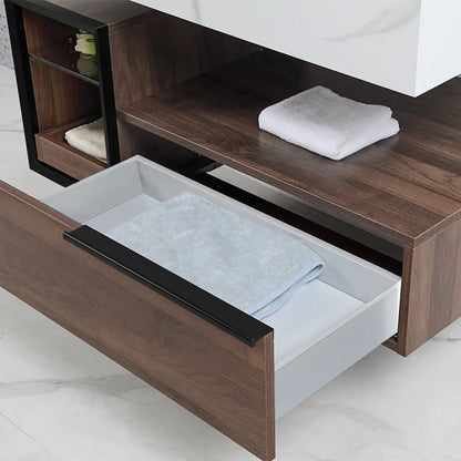 Wooden bathroom cabinet with open drawer containing folded towels.
