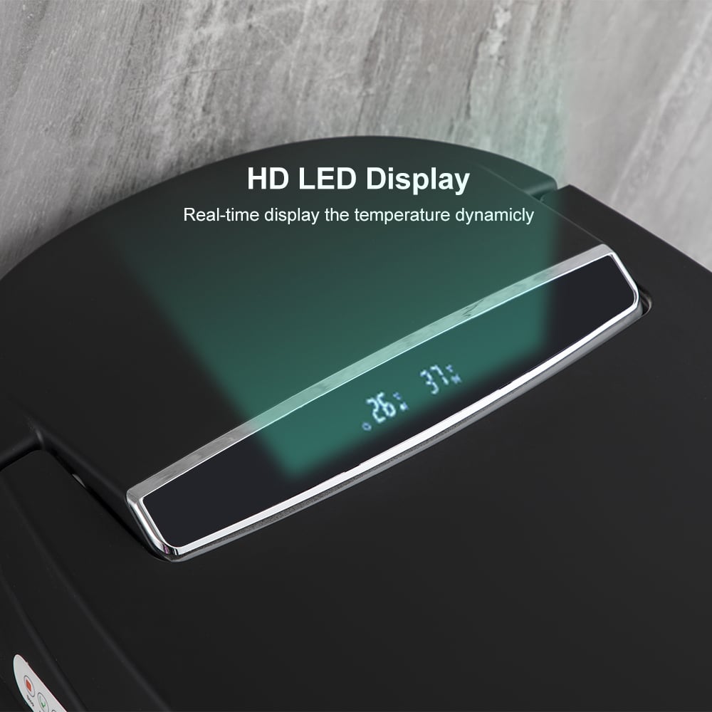 Black electronic device with HD LED display showing temperature and humidity on a gray wooden surface.