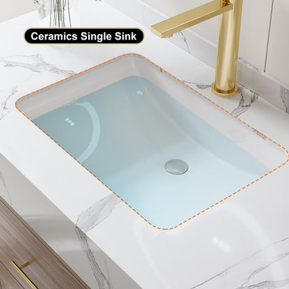 Ceramic single sink with gold faucet on a marble countertop