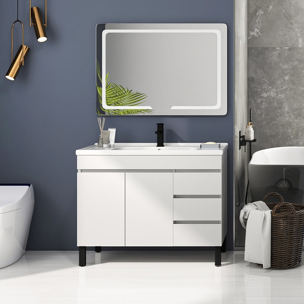 Bathroom vanity with mirror, sink, and decorative elements against a gray wall.