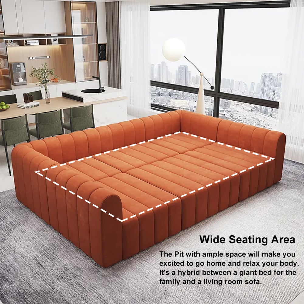 Orange sectional sofa in a modern living room with kitchen in the background