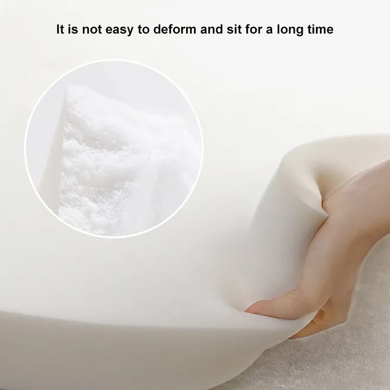 Silicone mat with a hand holding it, showing its texture and durability.