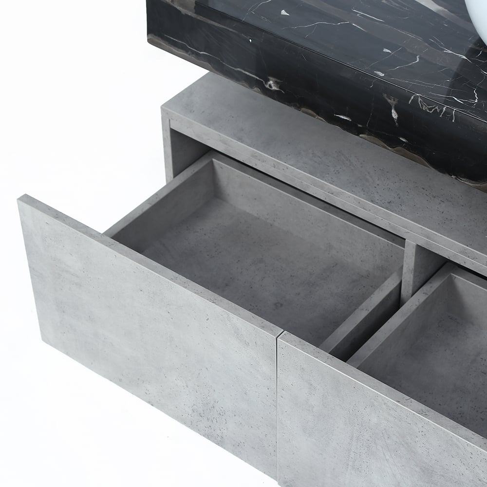 Bathroom vanity with concrete finish and open drawer