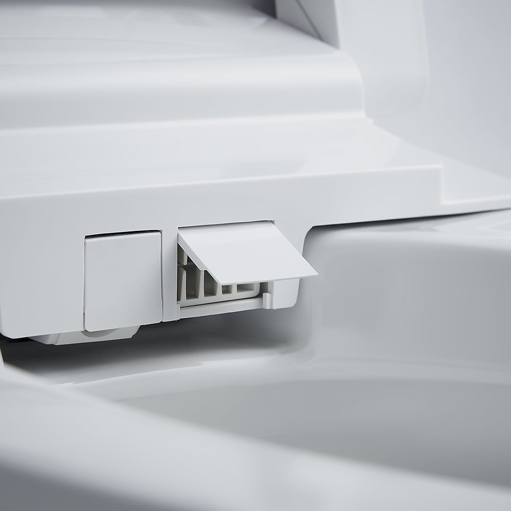 Close-up of a white appliance with a drawer or compartment open, on a light gray background.