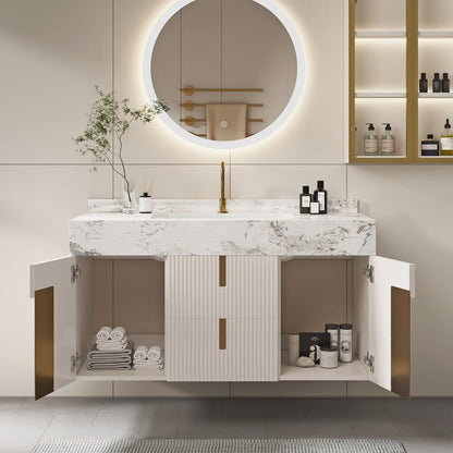 Modern bathroom vanity with marble countertop, round mirror, and open cabinet doors.