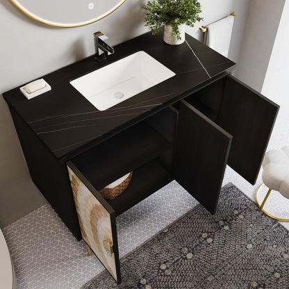 Bathroom vanity with black countertop, white sink, and open cabinet door.