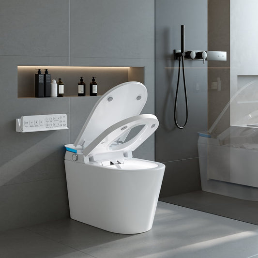 Modern white toilet in a bathroom setting with gray walls and a shower area.