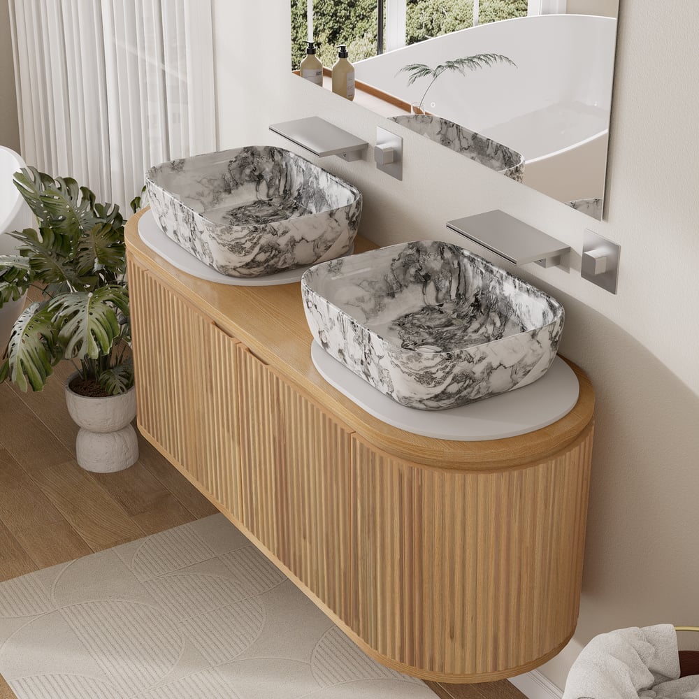Bathroom vanity with marble-textured sinks and wooden cabinet