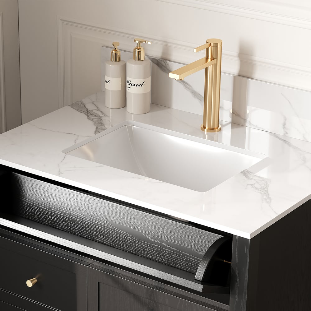 Modern kitchen sink with gold faucet and marble countertop