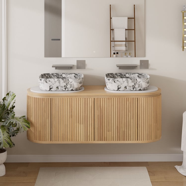 Bathroom vanity with two black and white patterned sinks, wooden cabinet, and decorative elements.