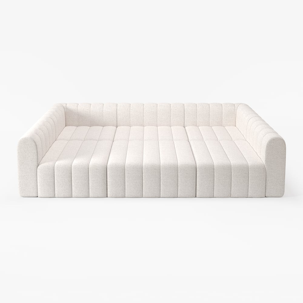 White sofa with a quilted design on a white background