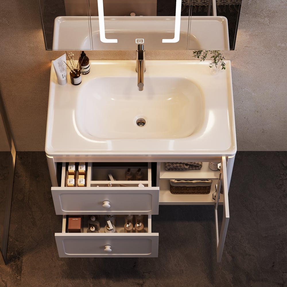 Bathroom vanity with sink and open drawer, featuring various toiletries.