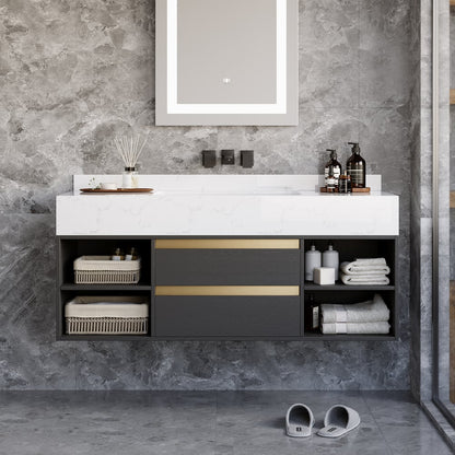 Bathroom vanity with white countertop and black cabinets against a gray stone wall.