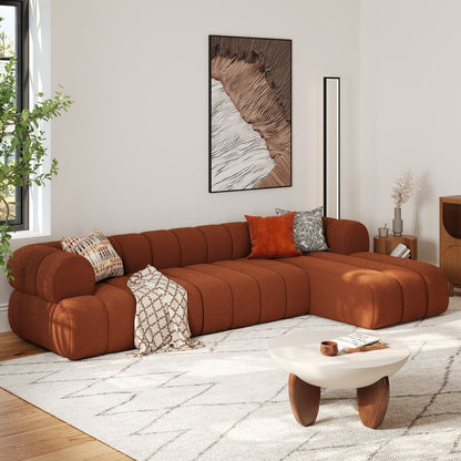 Brown sectional sofa in a living room with a coffee table and decorative pillows.