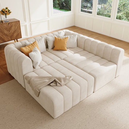 Off White sectional sofa with cushions in a bright living room