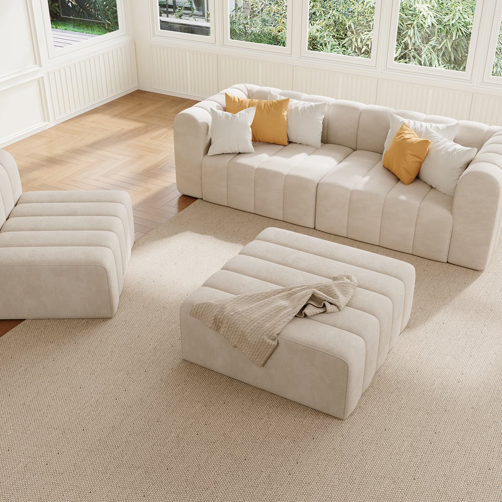 Off white sectional sofa with ottomans in a living room setting