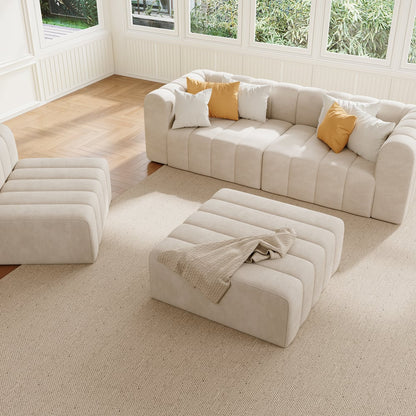 Off white sectional sofa with ottomans in a living room setting