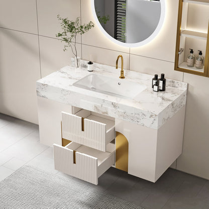 Modern bathroom vanity with marble countertop, sink, and gold fixtures.