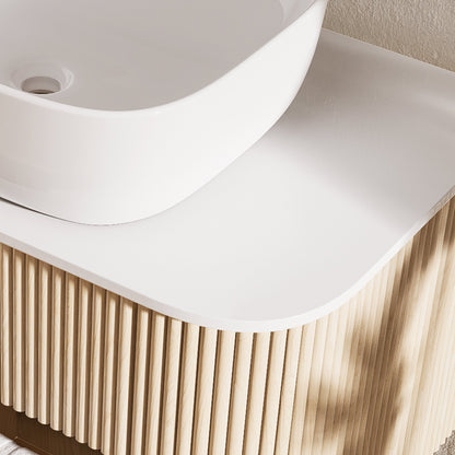 White sink on a wooden vanity
