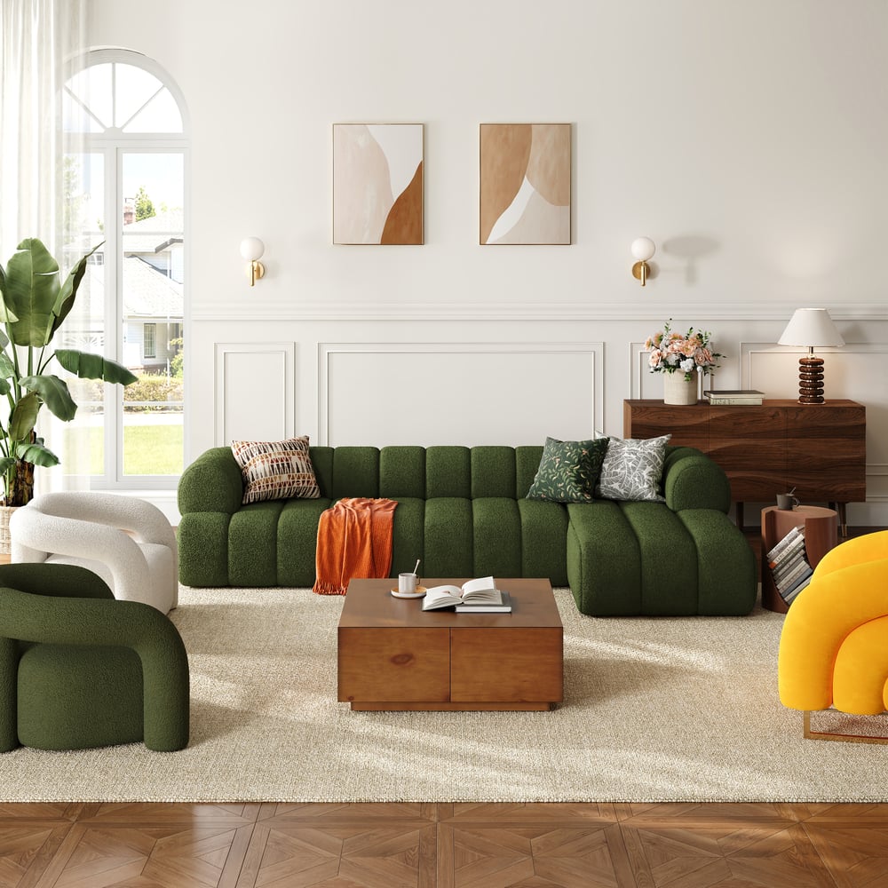 Modern living room with green sofa, wooden coffee table, and decorative elements.