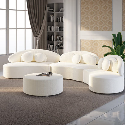 Modern white sofa set in a stylish living room with bookshelf and decor.