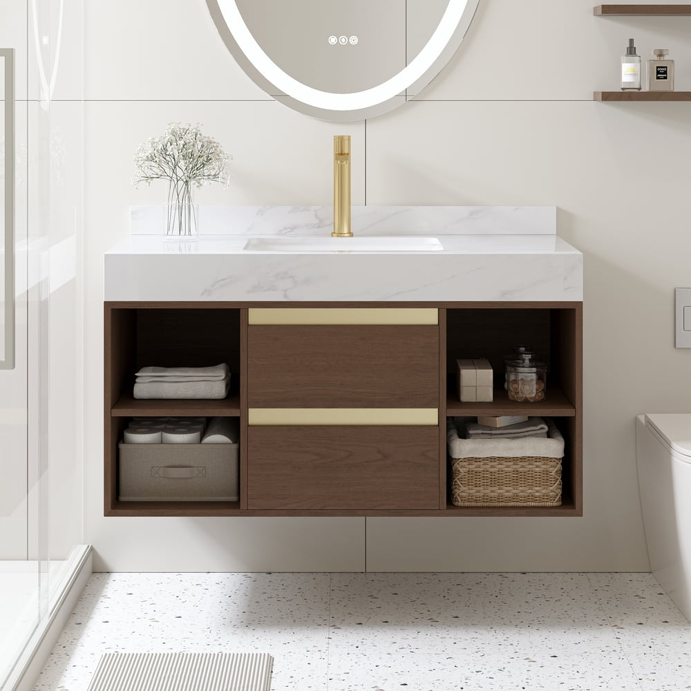 Bathroom vanity with wooden cabinets, marble countertop, and round mirror.