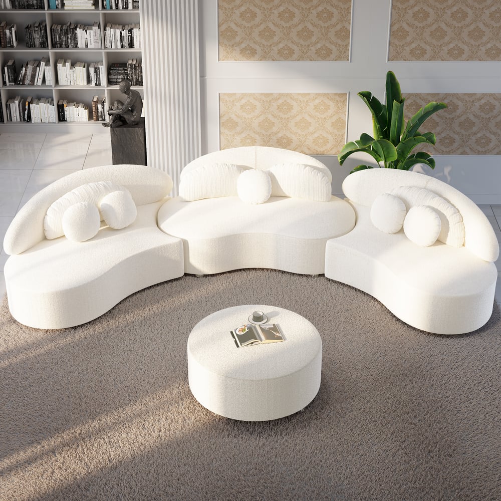 Modern white sofa with round cushions in a stylish living room.