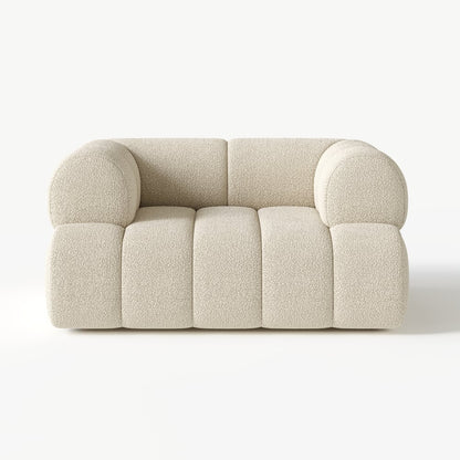 Beige sofa with rounded armrests on a white background
