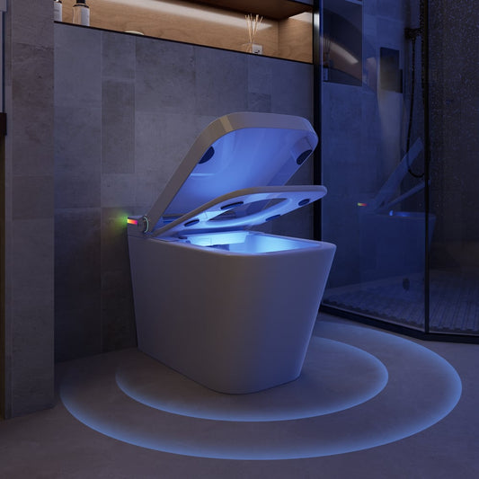 White toilet with glowing blue light in a dark bathroom setting