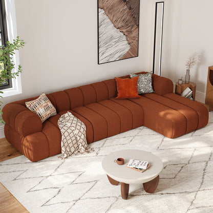 Brown sectional sofa in a living room with a coffee table and decorative pillows.